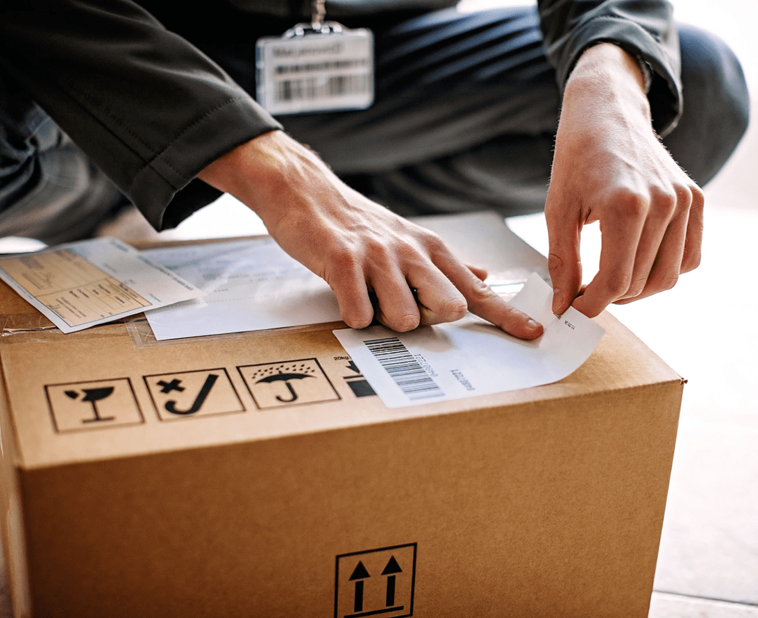 Package with shipping labels being applied